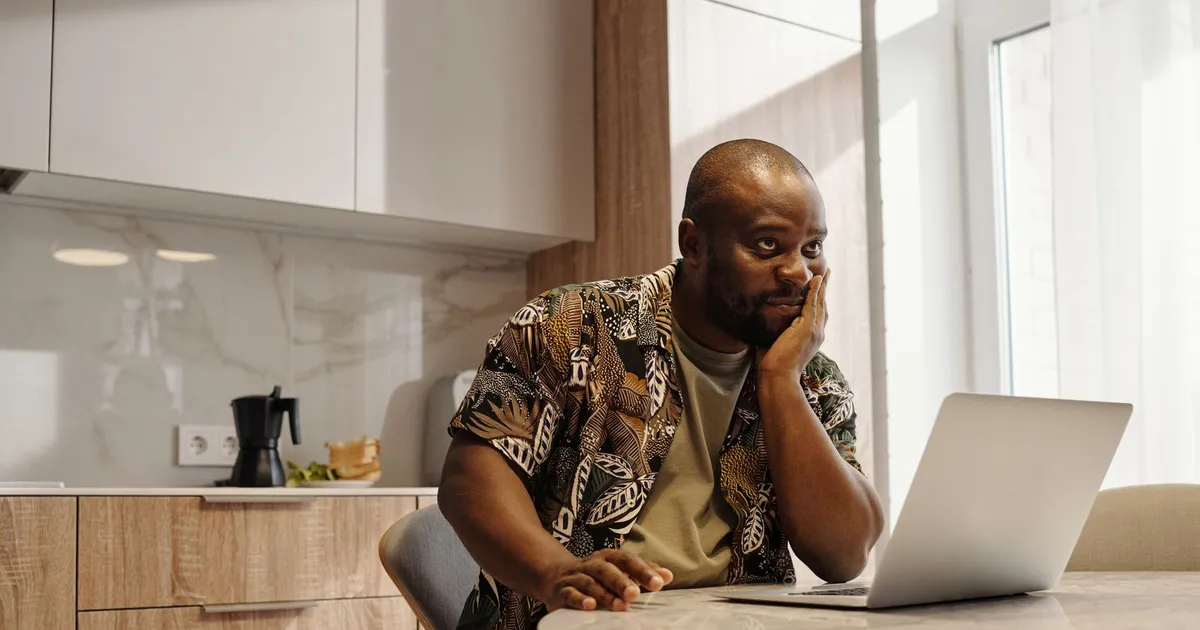 Person calmly reviewing bank statements at home before applying for bad credit loans Scarborough lenders approve on income